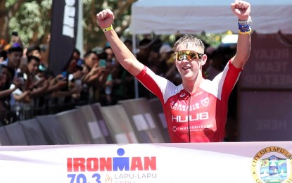 CHAMPION. South African Henri Schoeman, bronze medalist at the 2016 Rio Olympics, celebrates his victory in the IRONMAN 70.3 Lapu-Lapu in Cebu on April 21, 2024. The blue-ribbon event, which is expected to attract a dynamic mix of local and international triathletes, will be held on August 10, 2025. (Contributed photo)