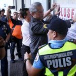 GAME OVER. Interior Secretary Jonvic Remulla (center) and other government officials lead the formal closure of the Island Cove resort-turned Philippine offshore gaming operator facility in Kawit, Cavite on Tuesday (Dec. 17, 2024). The POGO facility, located on a 33-hectare property, is the biggest in the country. (PNA photo by Yancy Lim)