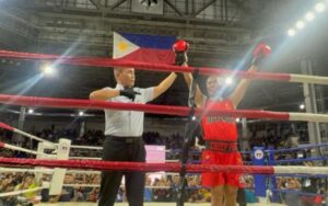 WINNER BY DEFAULT. Boxing referee raises the hand of PNP chief Gen. Nicolas Torre for winning by default in a charity boxing match against acting Davao City Mayor Sebastian “Baste” Duterte at the Rizal Memorial Coliseum in Manila on Sunday (July 27, 2025). Duterte did not show up at the event. (PNA photo by Lloyd Caliwan)