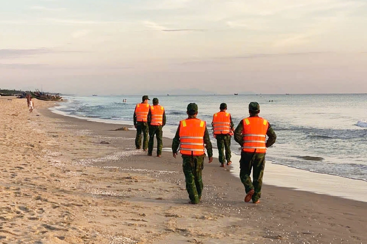 Border guards searching along the coastline.