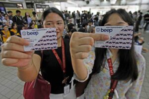 Two students from Lyceum of the Philippines (LPU) show their newly acquired white beep cards on Saturday, September 20, 2025, at the LRT Central Station in Manila. Commuters with white beep cards are entitled to a 50 percent fare discount on the LRT-1, LRT-2, and MRT-3 train lines. DANNY PATA