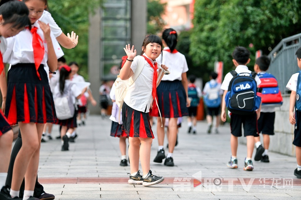At Chongqing Xie Jia Wan School, students greet each other.