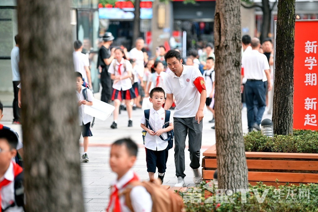 At Chongqing Xie Jia Wan School, a teacher gives directions to a new student.