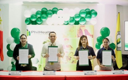 HEALTH PROTECTION. (From left to right) Germaine Tan, PhilHealth-11’s Field Operations Division OIC; Harvey Carcedo, PhilHealth-11 regional vice president; Renee Enriquez, Regional Fisheries Training OIC, and Dr. Elaine Vera Belvis, BFAR-11 FMRED Chief, display the signed memorandum of agreement on Monday (Sept. 29, 2025). The partnership aims to extend comprehensive health protection to fisherfolk communities across the Davao Region. (Photo courtesy of PhilHealth-11)