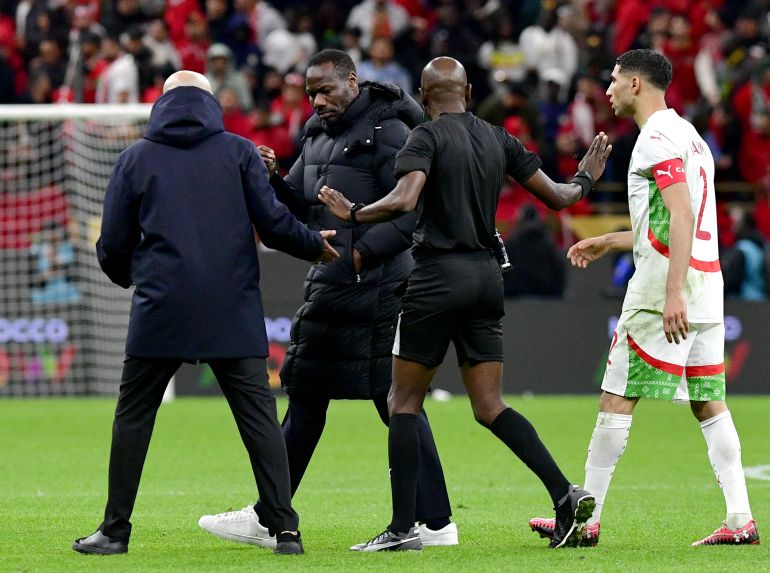 Senegal head coach Pape Thiaw walks off the pitch after a penalty has been awarded to Morocco during the Africa Cup of Nations final football match between Senegal and Morocco in Rabat, Morocco.
