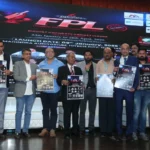 पोस्टर का विमोचन करते आयोजक।