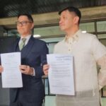 Atty. Andre de Jesus (L) and Pusong Pinoy Party-List Representative Jernie Jett Nisay (R) hold copies of the impeachment complaint the former filed against President Ferdinand 'Bongbong' Marcos Jr. on Monday, January 19, 2026, with the House of Representatives. Nisay endorsed the complaint. ISA UMALI/Super Radyo dzBB