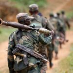 FILE PHOTO: Democratic Republic of Congo military personnel (FARDC) patrol against the Allied Democratic Forces (ADF) and the National Army for the Liberation of Uganda (NALU) rebels near Beni in North-Kivu province, December 31, 2013. The Democratic Republic of Congo is struggling to emerge from decades of violence and instability, particularly in its east, in which millions of people have died, mostly from hunger and disease. A 21,000-strong United Nations peacekeeping mission (MONUSCO) is stationed in the country. REUTERS/Kenny Katombe/File Photo