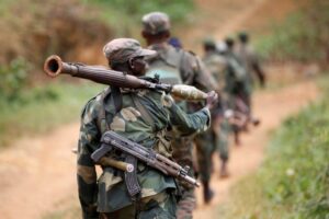 FILE PHOTO: Democratic Republic of Congo military personnel (FARDC) patrol against the Allied Democratic Forces (ADF) and the National Army for the Liberation of Uganda (NALU) rebels near Beni in North-Kivu province, December 31, 2013. The Democratic Republic of Congo is struggling to emerge from decades of violence and instability, particularly in its east, in which millions of people have died, mostly from hunger and disease. A 21,000-strong United Nations peacekeeping mission (MONUSCO) is stationed in the country. REUTERS/Kenny Katombe/File Photo