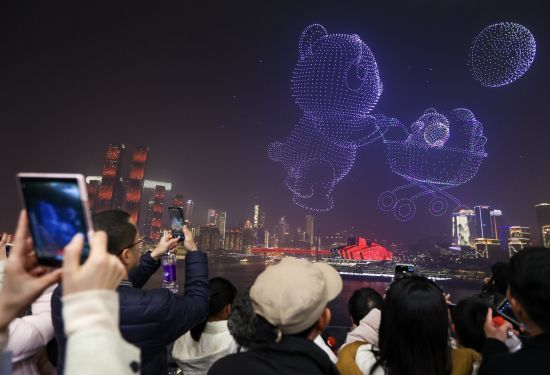 Citizens watch a panda-themed drone performance at the Chongqing International Reception Hall.