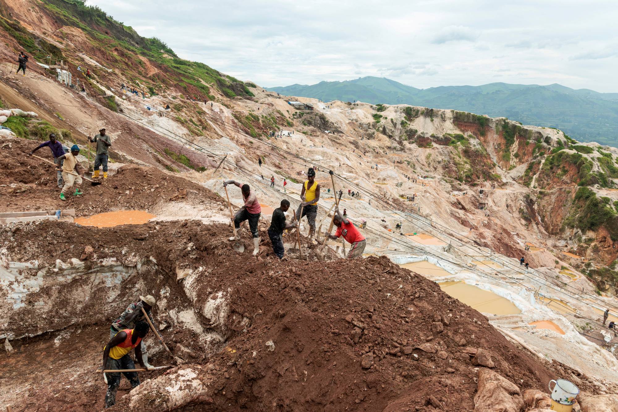 Workers dig at a coltan mine in the town of Rubaya, controlled by M23 rebels in eastern Democratic Republic of Congo