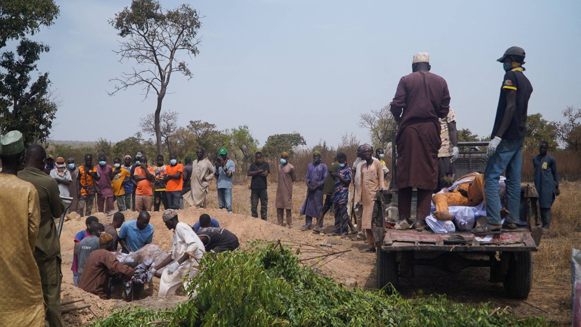 Burying the bodies of victims of the armed terrorist attack on Wuro village in Kwara State