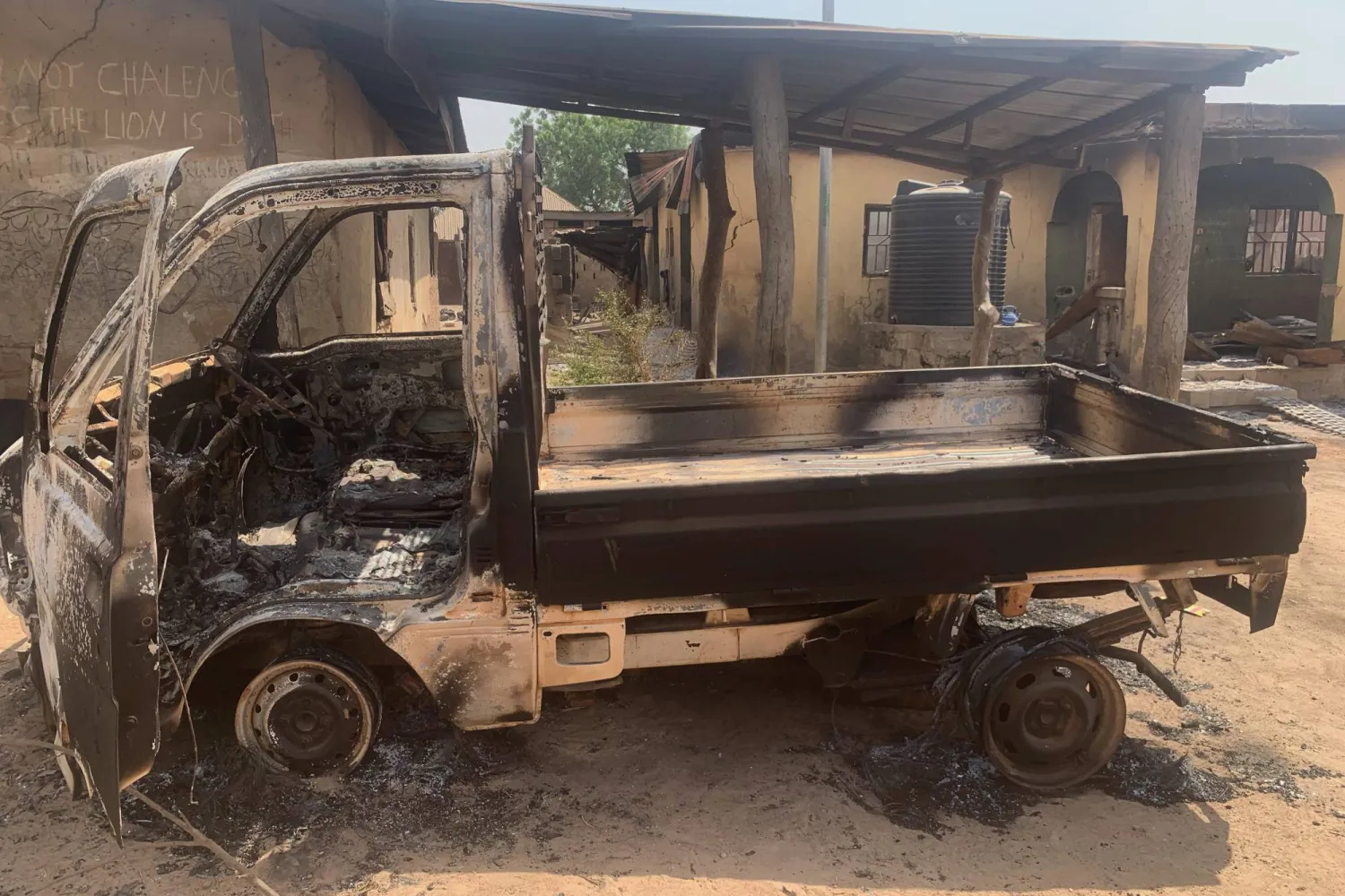 Destroyed vehicles and houses resulting from the armed attack on Wuro village in Kwara State