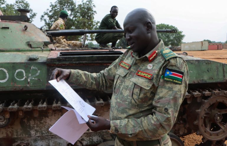 Major General Lul Ruai Koang, spokesperson for the South Sudan People's Defence Forces (SSPDF), shows journalists a captured BMP-2 infantry fighting vehicle nicknamed “Boorchar” seized by Sudan People's Liberation Movement-in-Opposition (SPLA-IO) fighters from an Indian peacekeeping unit serving under the United Nations Mission in South Sudan (UNMISS) during the 2013 conflict, after a press conference on the military operations in Akobo and ordering the withdrawal of UNMISS from the area; at the SSPDF armoury barracks in Juba, South Sudan March 6, 2026.