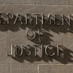 A sign for the US Department of Justice in Washington, D.C., April 6, 2026. REUTERS/Kevin Lamarque