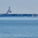 The USS Gerald R. Ford aircraft carrier leaves Naval Station Norfolk, June 23, 2025, in Norfolk, Va. (AP Photo/John Clark, File)