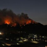 A wildfire approaches the Kirikiri district of Otsuchi, Iwate Prefecture, northeastern Japan, on the evening of April 24, 2026. (Kyodo)