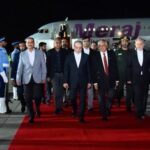 CORRECTION / This handout photograph taken and released by Pakistan's Press Information Department (PID) on April 25, 2026 shows Pakistan's Foreign Minister Ishaq Dar (C-R) and Army Chief Syed Asim Munir (2ndL) walking with Iran's Foreign Minister Abbas Araghchi (C) upon his arrival at Nur Khan air base in Rawalpindi, near Islamabad.