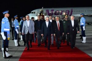 CORRECTION / This handout photograph taken and released by Pakistan's Press Information Department (PID) on April 25, 2026 shows Pakistan's Foreign Minister Ishaq Dar (C-R) and Army Chief Syed Asim Munir (2ndL) walking with Iran's Foreign Minister Abbas Araghchi (C) upon his arrival at Nur Khan air base in Rawalpindi, near Islamabad.