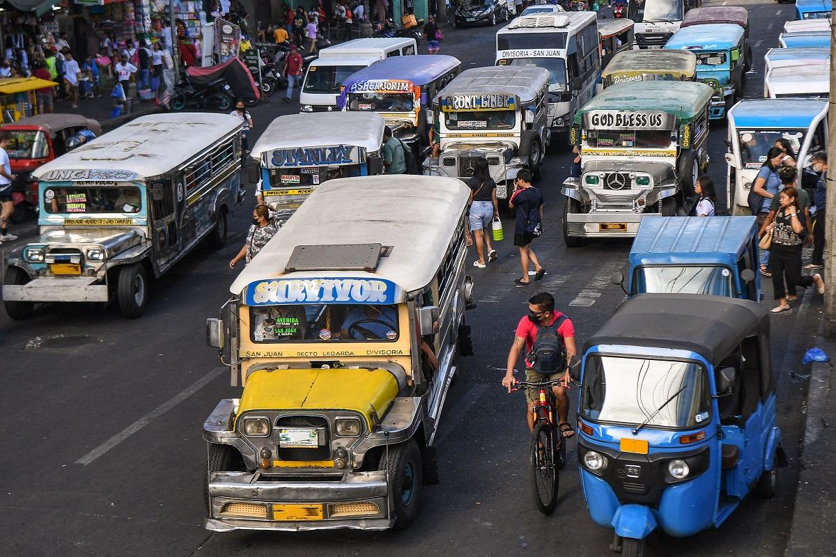 Jeepneys commute along a street in Manila on April 5, 2024. Ted Aljibe/ AFP