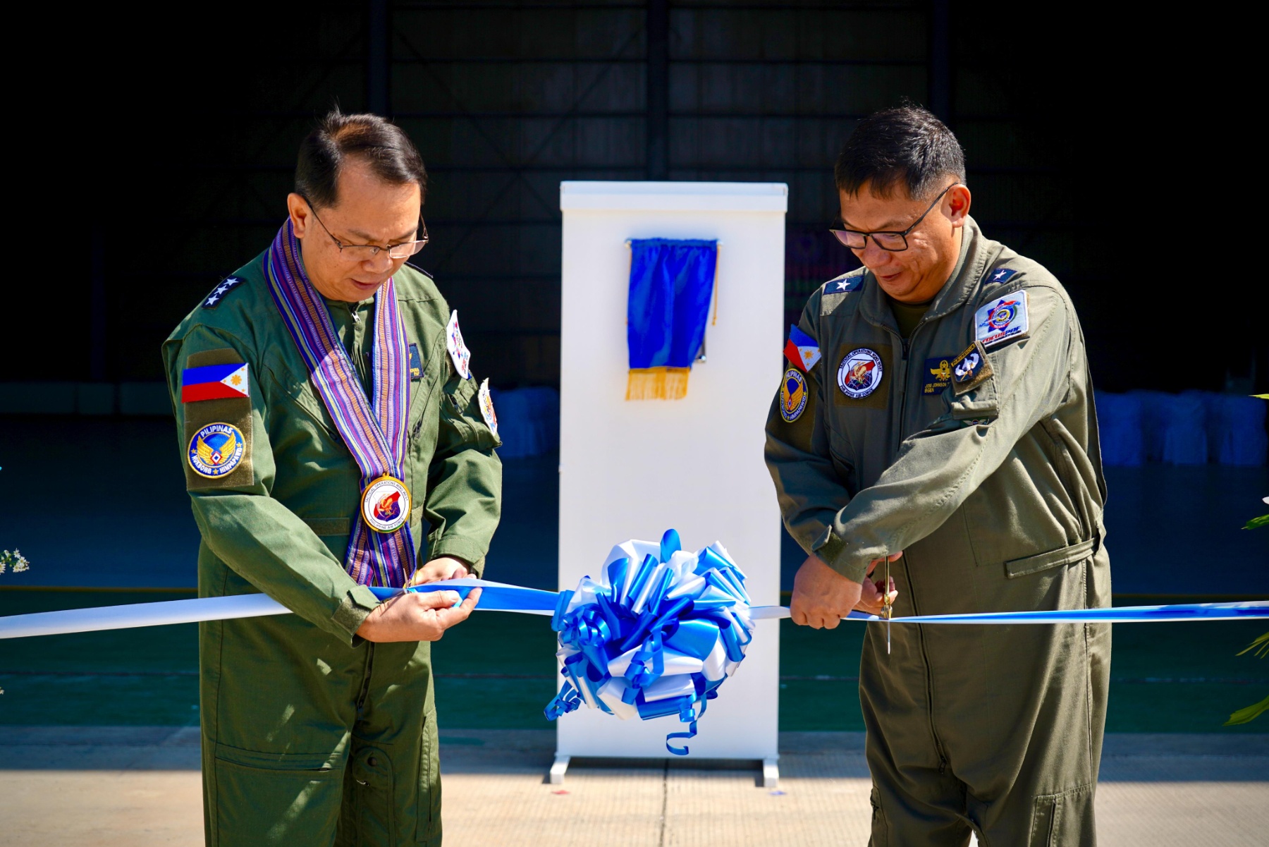 Philippine Air Force Commanding General Lieutenant General Arthur Cordura and Brigadier General Jose Johnson Grayda, Wing Commander of the Tactical Operations Wing West, lead the ribbon-cutting rites of the Basing Support System at Pag-asa Island on Thursday, April 23, 2026. (Photo from Philippine Air Force)