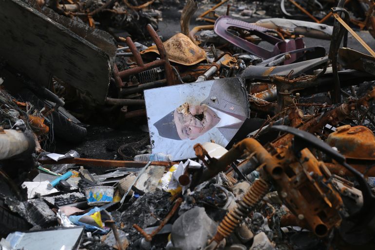 A vandalized photo of the deposed Nepali Prime Minister lies along with the debris of the charred remains of the vehicle inside Singhadurbar in Kathmandu, Nepal, on September 19, 2025, following last week's Gen-Z revolution. In the aftermath of the GenZ protests, insurance claims continue to rise, with preliminary claims standing at staggering numbers, 20.70 billion, which reflects the scale of destruction unleashed during the September 8 and 9 agitations. According to records with the Nepal Insurance Authority (NIA), a total of 1,984 claims are filed by Thursday, almost all linked to private businesses and properties. With public structures uninsured, companies are spared from additional exposure except for government vehicles under third-party liability coverage. Some insurers face unprecedented pressure.