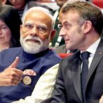 Prime Minister Narendra Modi talks to France President Emmanuel Macron (PTI)