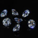 Round diamond faceted cubic zirconia set lot, cubic crystalline form of zirconium dioxide (ZrO2) colorless synthesized material. White synthetic gemstones. Diamond imitation. Black isolated background; Shutterstock ID 1992356717; purchase_order: ajanet; job: ; client: ; other: