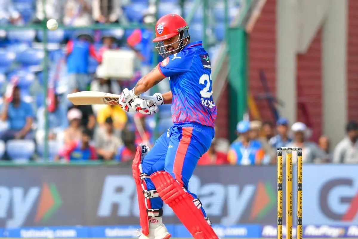 केएल राहुल और नीतिश राणा (फोटो- IANS)