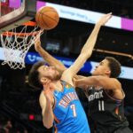 Phoenix Suns forward Oso Ighodaro (11) shoots over Oklahoma City Thunder center Chet Holmgren (7) in the second half during game three of the first round of the 2026 NBA Playoffs at Mortgage Matchup Center, Phoenix, Arizona, USA on April 25, 2026. Rick Scuteri-Imagn Images via Reuters