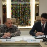 Chief Investment Officer (CIO) of Danantara Indonesia, Pandu Sjahrir (left), and a representative of Zhejiang Weiming Environment Protection Co., Ltd. (right) sign a cooperation agreement to manage the Waste-to-Energy (WtE) facility in Greater Bogor, on Saturday (14/03/2026). (ANTARA/HO-Danantara)