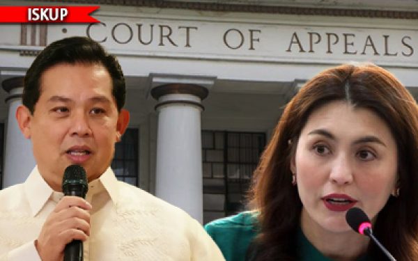 Two people speak to reporters outside the Court of Appeals building; a man holds a handheld microphone while a woman speaks at a separate mic in front of columns.