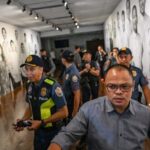 Police personnel guide the media after the exchange of gunshots inside the Senate of the Philippines in Pasay, Metro Manila on May 13, 2026.