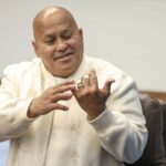 Sen. Ronald "Bato" Dela Rosa shows his bandaged fingers to reporters before the Senate plenary session on May 12, 2026, a day after National Bureau of Investigation agents pursued him through the building to serve an arrest warrant.