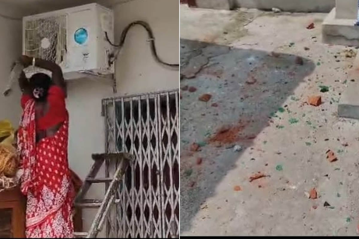 এসি ভাঙছেন বিক্ষুব্ধ মহিলা (বাঁ দিকে)। জানলার কাচ ভেঙে ছড়িয়ে রয়েছে (ডান দিকে)।