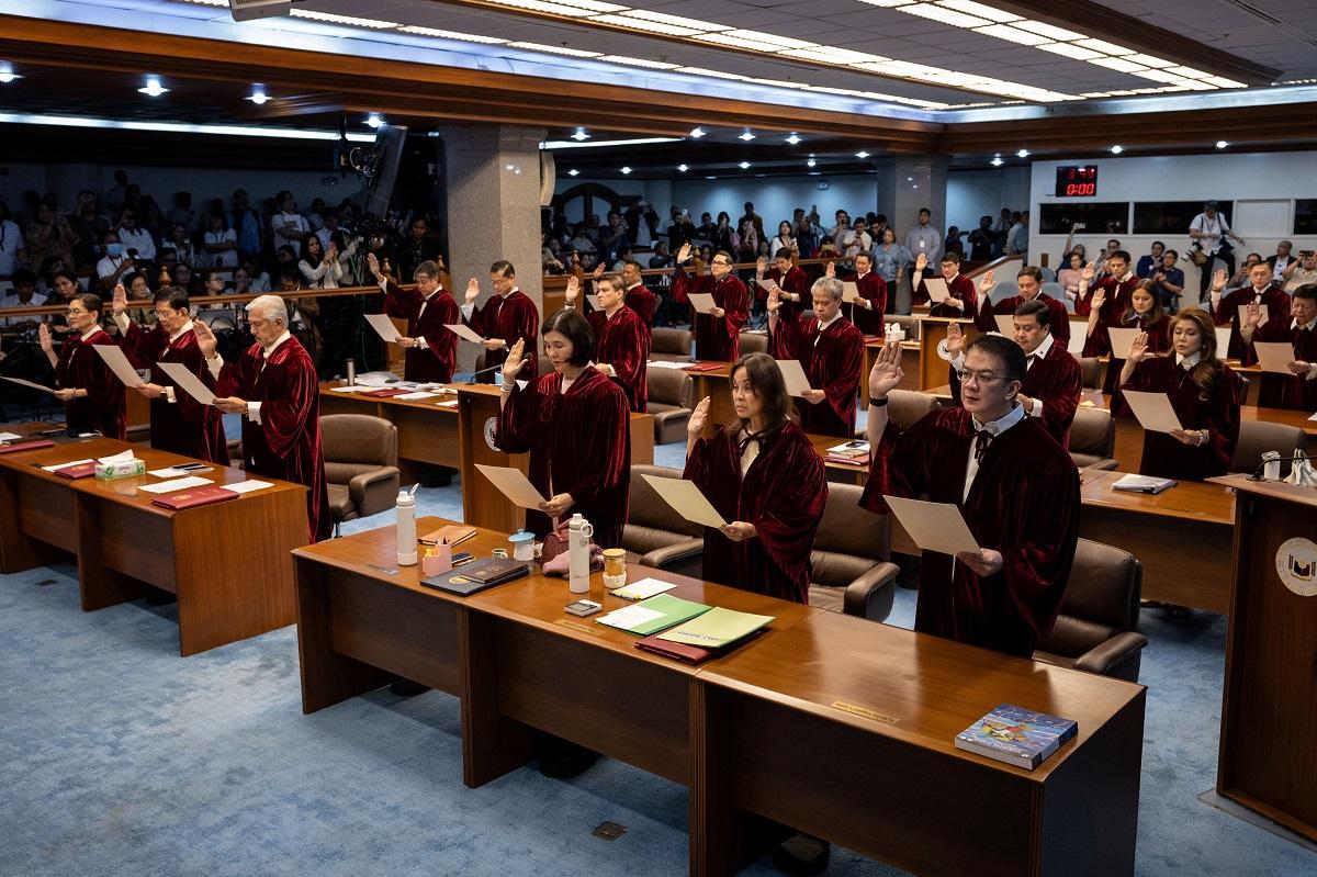 Senators take an oath as they convene as an impeachment court to hear the case of Vice President Sara Duterte, at the Senate in Pasay City, May 18, 2026. REUTERS/ Eloisa Lopez