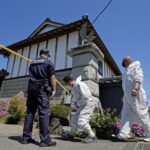 Investigators enter the scene of a robbery-murder case in Kaminokawa, Tochigi Prefecture, north of Tokyo, on May 17, 2026. (Kyodo)