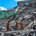 Rescue workers search for survivors among debris as a nine-storey building under construction collapsed in Balibago, Angeles City, Pampanga on Sunday, May 24, 2026. REUTERS/Noel Celis