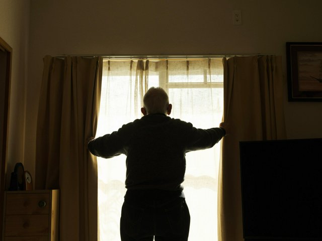 Opening curtains at a new home