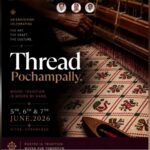 A colourful traditional woven textile displayed on a loom, showcasing intricate craftsmanship and cultura.