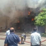 Fire personnel working to douse the blaze