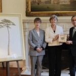 Officials from the United Kingdom and Japan pose for a commemorative photo at the British Embassy in Japan with seeds from the cloned successor of the "Miracle Pine," which are set to be stored in Britain. (Photo courtesy of Sumitomo Forestry Co.)