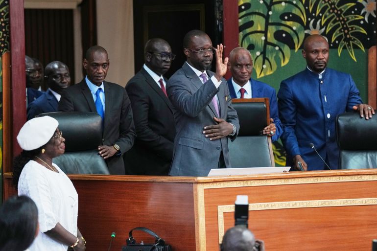 Ousmane Sonko, center, arrives to deliver a speech following his election as President of the National Assembly in Dakar, Senegal, Tuesday, May 26, 2026.