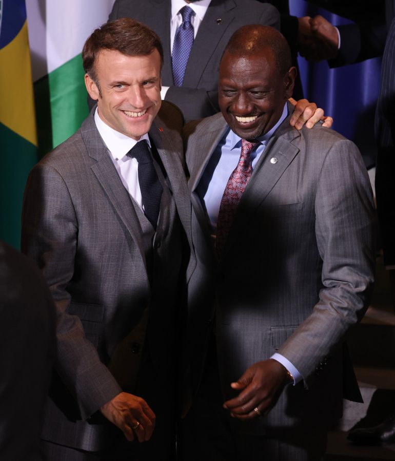 BERLIN, GERMANY - NOVEMBER 20: French President Emmanuel Macron (L) and William Ruto, President of Kenya, share a laugh at the G20 Compact With Africa conference on November 20, 2023 in Berlin, Germany.