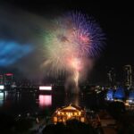 A fireworks display lights up the skyline along the Saigon River in HCMC - PHOTO: LE VU