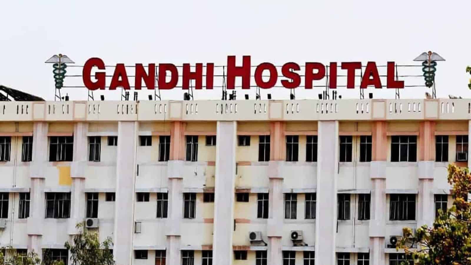 Gandhi Hospital building with prominent red signage in Hyderabad, India, serving as a major healthcare fa.