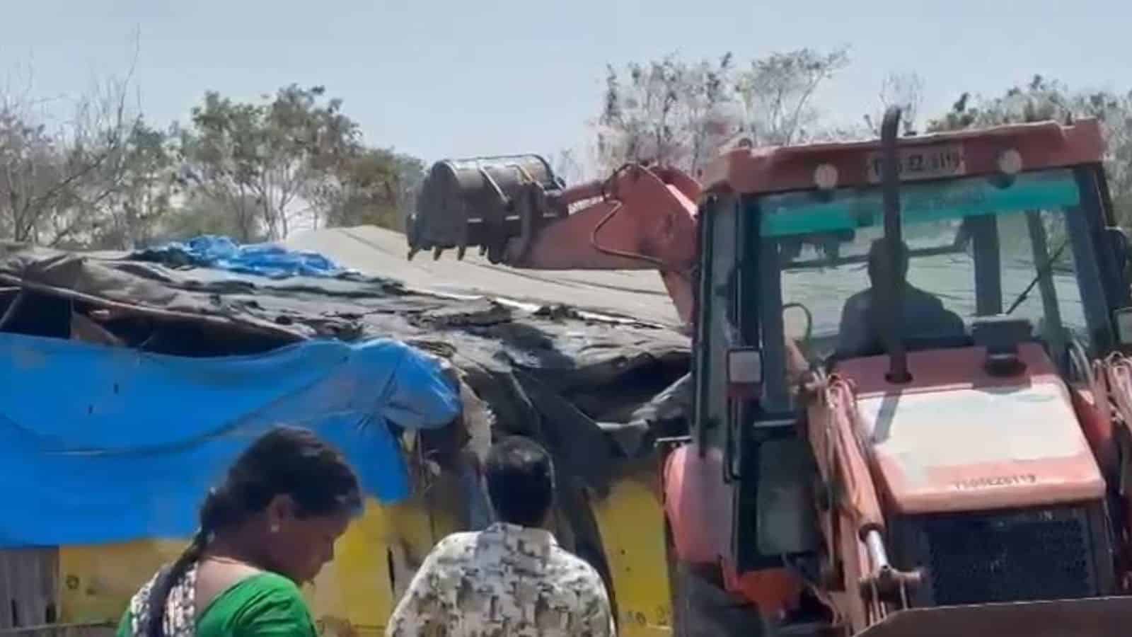 A JCB in action during an anti-encroachment drive